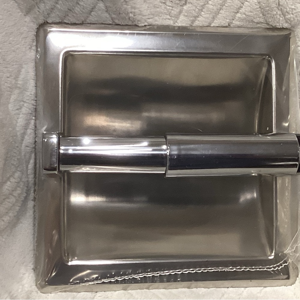 The chrome recessed toilet paper holder from the Seton Collection